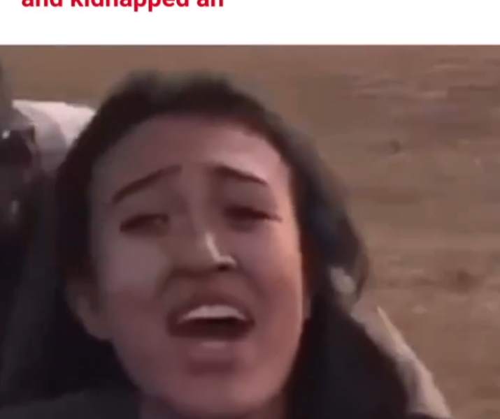 A woman in being kidnapped by Hamas