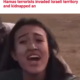A woman in being kidnapped by Hamas