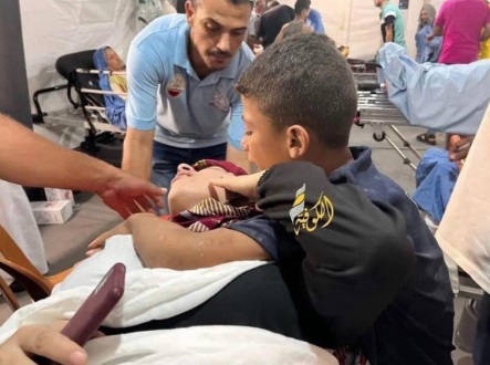 A "dead man" holding a cell phone. Credit: Inbar Cohen FB page.